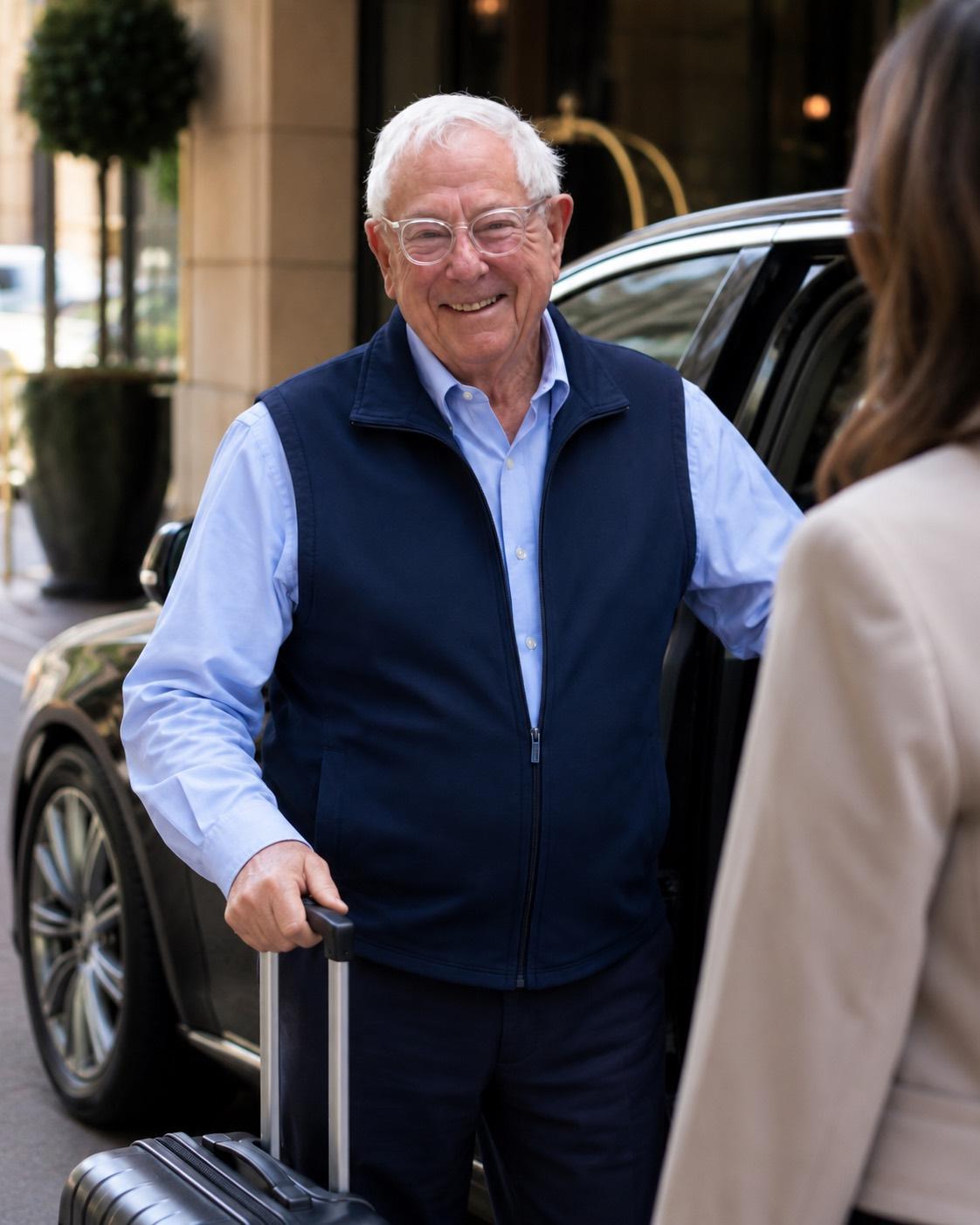 Louis Van Leeuwen greeting a client with her luggage